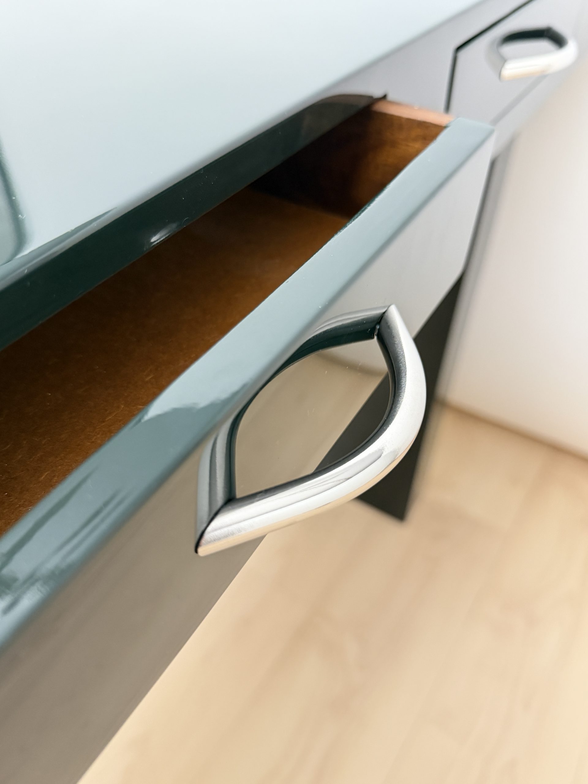 Detail of chrome handles on Italian design console, 1970s